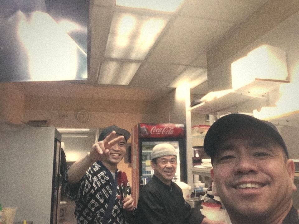 Junior taking a selfie with two smiling kitchen coworkers